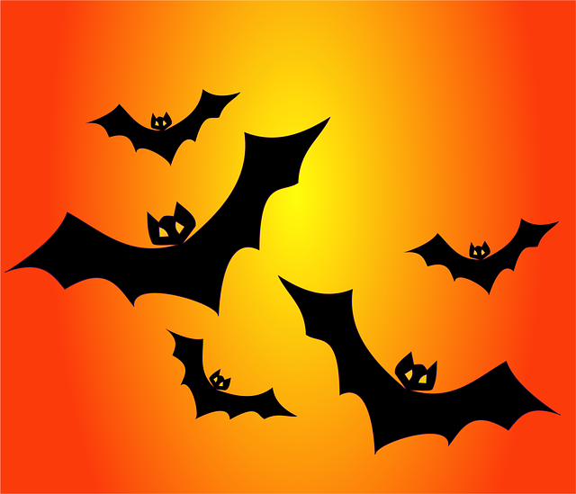 Pixabayのハロウィン用コウモリのシルエットイラスト、オレンジ〜黄色のグラデーション背景